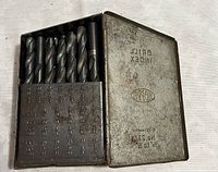 Metal case labeled Bopp No. 29 Hi-Lo containing assorted metal drill bits of various sizes.