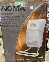 Box showing the NOMA bathroom convection heater with towel bar. The box displays product features including hardware installation, adjustable thermostat, thermal cut-off protection, and power ratings.