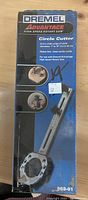 Image of Dremel Advantage High-Speed Rotary Saw Circle Cutter in its original box showing product details and usage images.