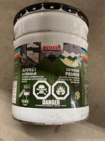 18.9L pail of Resisto Exterior Primer with hazard symbols and bilingual label