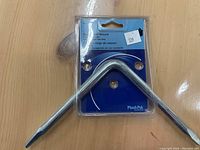 Photo of a new faucet seat wrench in Plumb Pak branded packaging, showing chrome L-shaped wrench with two different sized ends.