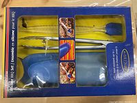 Photo showing a 4-piece silicone BBQ set in blue color inside packaging including grill mitt, tongs, basting brush, and gloves.
