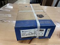View of the product box showing detailed label with specifications including 1/2HP, 230V, 60Hz single phase, part number FP217-B10.