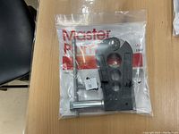 Master Plumber Universal Crimping Tool in original plastic packaging with tool and attachment visible.