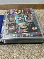 Side view of thick blue binder filled with pages of Star Trek trading cards