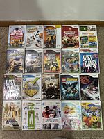 Photo showing 20 Nintendo Wii game cases laid out in a grid showing titles and condition.
