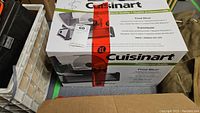 Original retail box showing Cuisinart logo and model CFS-155C food slicer image and text.