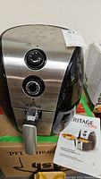 Front view of Heritage air fryer showing two control dials and air fryer handle.
