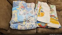 Transformers quilt and folded Star Wars bedding on sofa