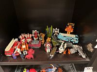 Overview of shelf with multiple G1 Transformers figures