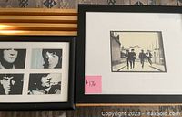 Photo showing both framed prints side by side on a table, highlighting size difference and framing.