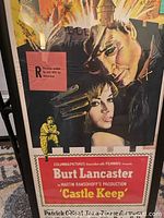 Front view of the professionally framed "Castle Keep" movie poster showing illustrated characters, title, and rating.