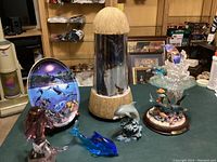 Photo showing all seven nautical-themed display pieces on green table