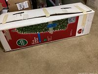 Box showing the tree's packaging with product image and specifications.