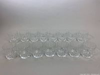 15 Waterford Marquee crystal double old fashioned whiskey glasses arranged in two rows on a plain background.