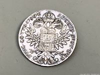 Front side of silver coin with crowned double-headed eagle and shield, inscriptions around edge.