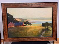 Full view of the framed textured canvas print showing barns, trees, and river landscape
