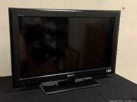 Front view of Sony 32-inch KDL-32L5000 LCD TV powered off, showing screen and bezel with stand.