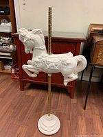 Assembled view of horse on pole and base
