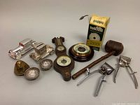 Full lot capture showing all items including clippers, salt cellars, barometer, wooden handled mallet, brass timer, and metal tools.