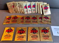 33 sealed 1992 Donruss McDonald's MVP baseball card packs displayed on a flat surface, showing the front gold foil packaging with logos and product details.