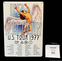 Authorized reproduction metal sign of Led Zeppelin 1977 U.S. Tour measuring 8.5" x 11.5" with tour cities and artwork.