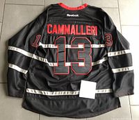 Back view of black Montreal Canadiens jersey showing stitched name 'Cammalleri' and number 13 with red outlining.