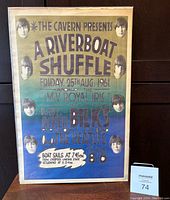 Front view of The Beatles 1961 Riverboat Shuffle concert poster, showing event details and Beatles faces.