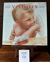 Front cover of Van Halen 1984 vinyl LP showing cherub artwork with cigarette and cigarette pack.