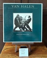 Front cover of Van Halen Women and Children First vinyl LP showing band members and album title.