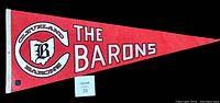 Full view of the red Cleveland Barons pennant with text and logo in white and black, laid flat to show overall condition and size.