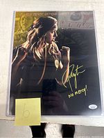 Signed Cobra Kai photo featuring Peyton List with signature and inscription, showing entire photo setup in protective casing.