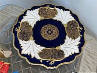 Top view showing detailed design of the decorative plate with cobalt blue, white and gold patterns