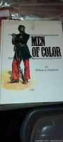 Front cover of the vintage hardcover book showing a Black Civil War soldier with a musket, titled 'Men of Color' by William A. Gladstone.
