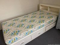 Single bed frame with mattress showing full length and three drawers.