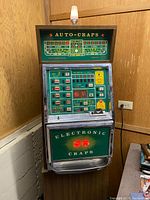 Full view of the electronic craps machine in corner of room