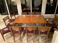 Full view of extended table and eleven chairs arranged around