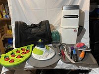 Full lot showing pet carrier, litter disposal system, grooming tools tray, puzzle games, feeding tray.