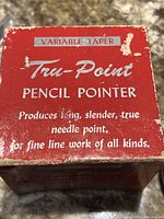 Top of original red box with 'VARIABLE TAPER Tru-Point PENCIL POINTER' text and wear marks.