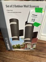 Box of the set of 2 outdoor wall sconces showing branding and product name