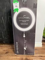 Box showing ErgoPixel brand and product details of the floor standing extendable ring light