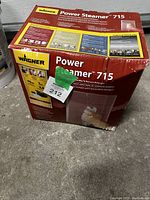 Box of Wagner Power Steamer 715 wallpaper remover with visible product branding and information.