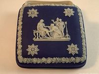 Top view of the deep blue Wedgewood dresser box with white mythological relief figures and floral border.