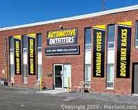 Exterior of Automotive Outfitters building with signage