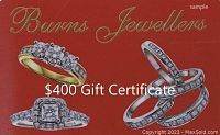 Red gift certificate close-up showing Burns Jewellers logo and $400 value