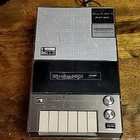 Top-down photo of the Optisonics Sound-O-Matic II Play-Bak cassette synchronizer with control buttons and labels clearly visible.