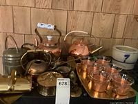Copper and brass coffee and tea serving set including kettles, cups, tray, watering can, crumb vacuum, and crock.