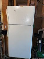 Front view of white Frigidaire refrigerator freezer unit showing full height and handles.