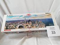 Box of the Eurographics AirPano Toronto 1000-piece panoramic puzzle showing the aerial cityscape image.