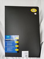 Front cover of the black Itoya Art Profolio Evolution folio with original labels showing brand and product features.